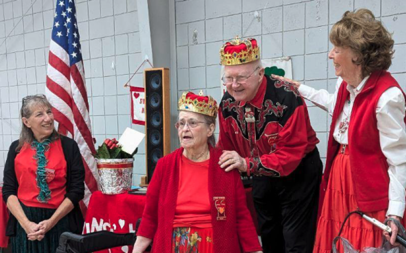 Bob and Lorrie Morrison were crowned the “King and Queen of Square Dance” by Sheryl Cantwell (right), Lorrie Morrison (left) and the Swingin Harts Square Dancers of Hartwell for their 25 years of calling dances for the club.
