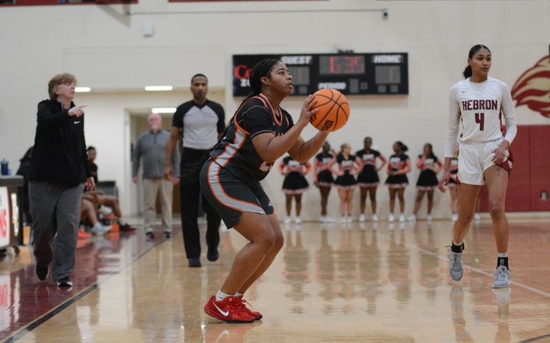 Senior guard TK Smith hits a three from the right corner in the 79-26 loss against Hebron.