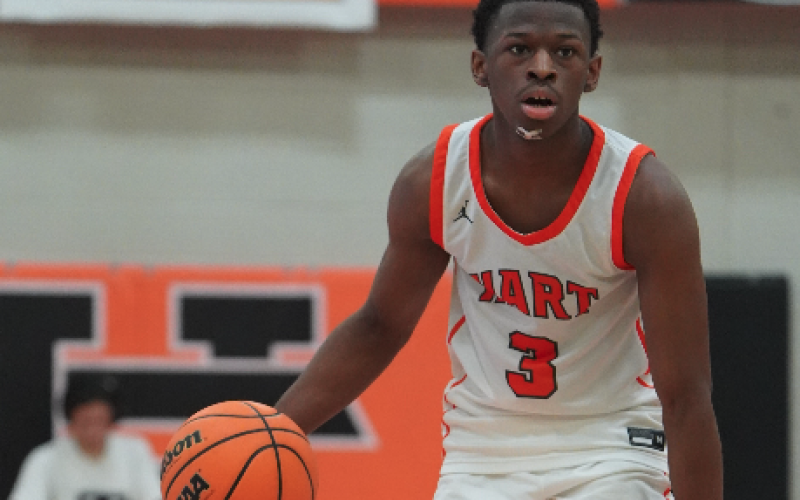 Senior guard Andrew Maxwell brings the ball up the court in a 75-67 overtime thrilling win over Franklin County. Photo submitted by DJ Groves.