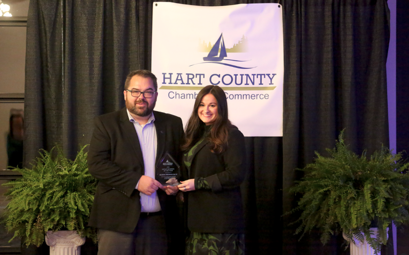 Haering Precision was named the Impact Business of the Year at the Hart County Chamber of Commerce banquet Feb. 21. Pictured receiving the award are (L-R) Plant Manager Dustin Chambers and Marketing Specialist Emma Durfee.
