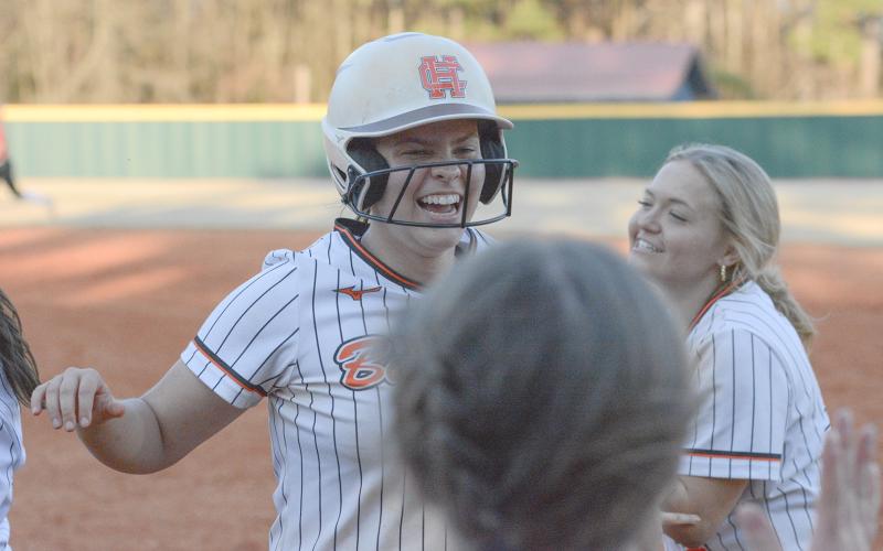 Sophomore Chesnee Strickland celebrates with her teammates moments after a walkoff double in the 11-10 win over the Lady Dragons of Jefferson on March 12. (Photo/Benjamin London)