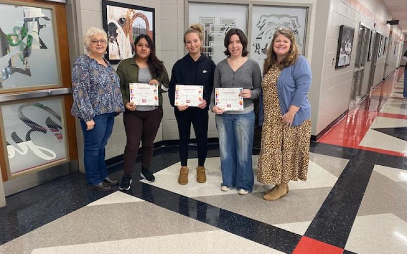 Hart County Farm Bureau art contest winners pictured with HCFB Women’s Committee Chair Stephanie Guzman and HCFB’s Tina Simmons include (clockwise, L-R) Guzman, Academic Christian Collective’s (ACC) Lila Layton and Simmons; Simmons, Hart County High School’s Maggie Rodrigues-Morales, Brooklyn Vassar, Maggie Noriega and Guzman; Guzman, ACC’s Layla Throckmorton and Simmons; and Guzman, ACC’s Titus McCall and Simmons. (Photo submitted by Tina Simmons)