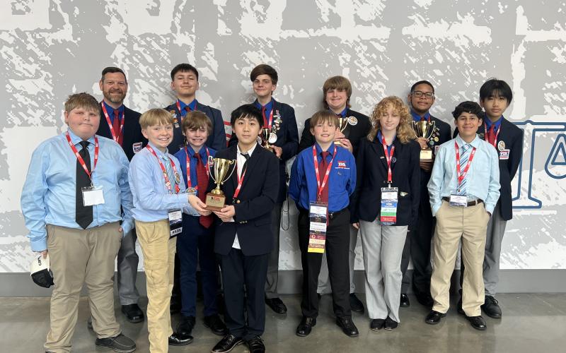 Pictured are the Hart County Middle School TSA students who recently attended the 2025 Georgia TSA State Conference: (front row, L-R) Easton Saylors, Nathaniel Metzger, John Bryant, Chance Vang, Connor Lewis, Kenzie McDuffie and Steve Franco; (back row, L-R) Joshua McCurley (advisor), Case Cothran, Henley Skelton, Garrett Ray, Jyrese Quillian and Johnson Dang. (Photo/Grayson Williams)