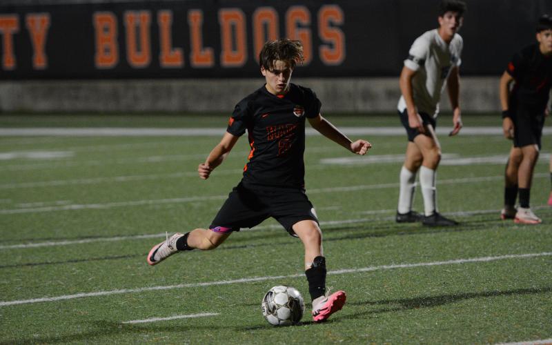 Senior right-back Aiden Sanders attempts a penalty kick in the 8-0 win over Washington-Wilkes. (Benjamin London)
