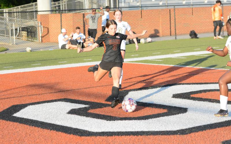 Freshman forward Autumn Ayers takes a shot on goal from a game earlier in the season as she scored the lone goal in the 3-1 loss to Shaw of Columbus in the state playoffs. (Photo/Benjamin London)