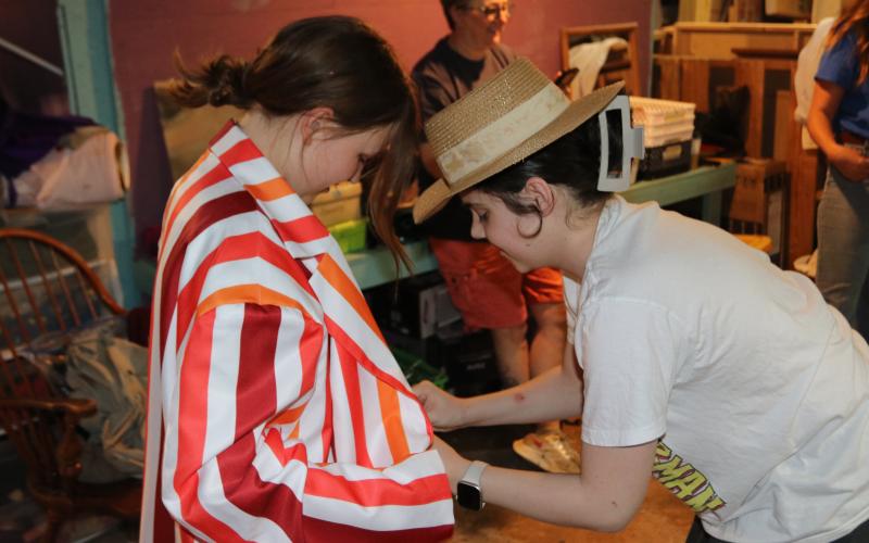 Hart County High School studentsDeborah Ingram and Ryley Hill, Hart County High School senior, attempt a quick costume change at Backstage Experience Day. Ingram is dressed as Bert from Mary Poppins, who only has a 30 second complete costume change during the song “Jolly Holiday.” (Photo/Adriana Cascio)