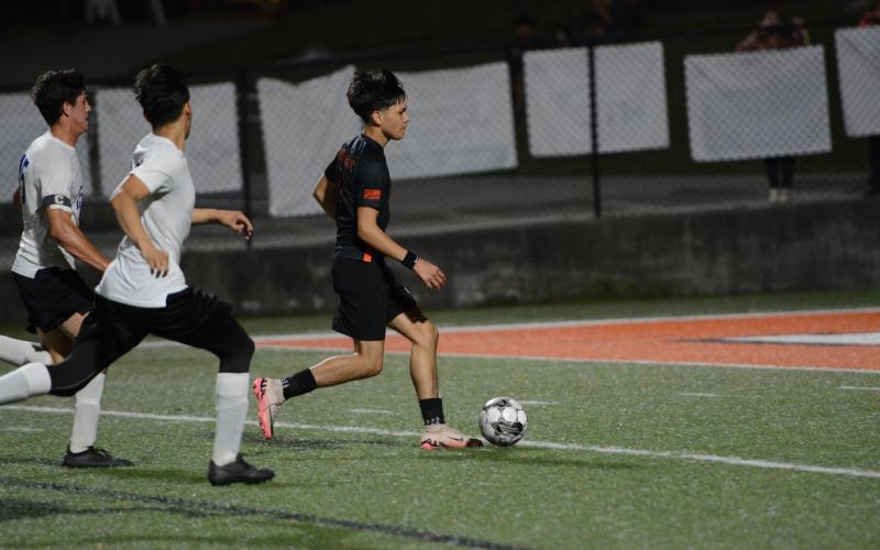 Freshman forward Cristopher Omar receives a through ball earlier in the season as he scored the lone goal in the 2-1 loss to Callaway in the first round of the state playoffs. (Photo/Benjamin London)
