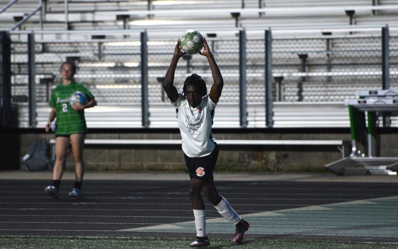 Center back Elijah Johnson throws the ball into play. (Photo/Benjamin London)