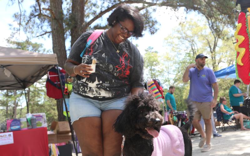 Event Attendee posing with her poodle at the 2025 Dam Dog Walk. (Photo/Adriana Cascio)