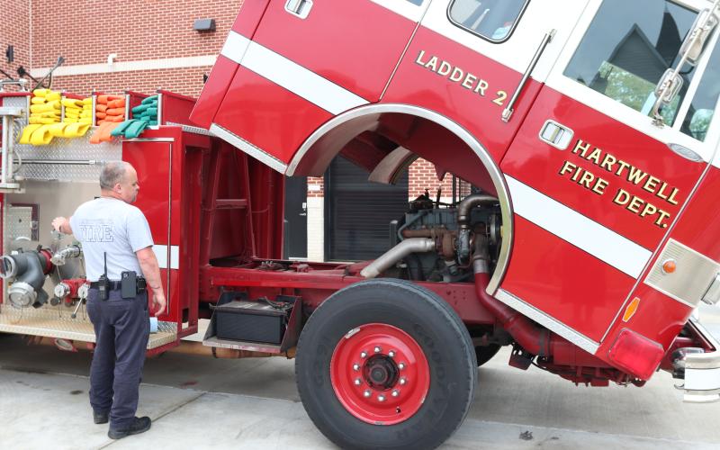 Hartwell Fire Department Lt. Mark Sanders inspects a truck outside the city station April 1. (Photo/Adriana Cascio)