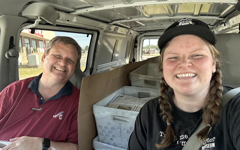 The Hartwell Sun and Franklin County Citizen Leader publisher daddy-daughter duo (L-R) Shane and Rose Scoggins loaded up in The Sun’s van to deliver newspapers after press delays last week. (Photo/Rose Scoggins)