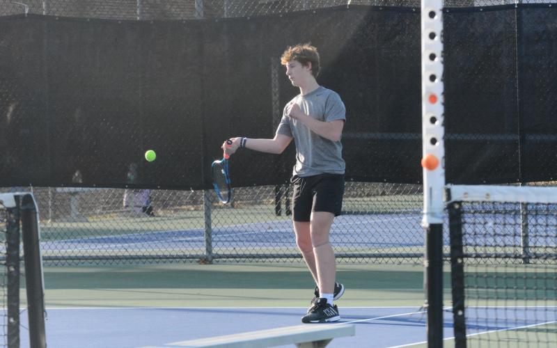 Sophomore Jackson Starrett returns a serve earlier in the season as he captured the win at No. 1 singles, 6-3, 6-2, in the 4-1 loss to Sumter County in the Sweet Sixteen on April 29. (Photo/Benjamin London)