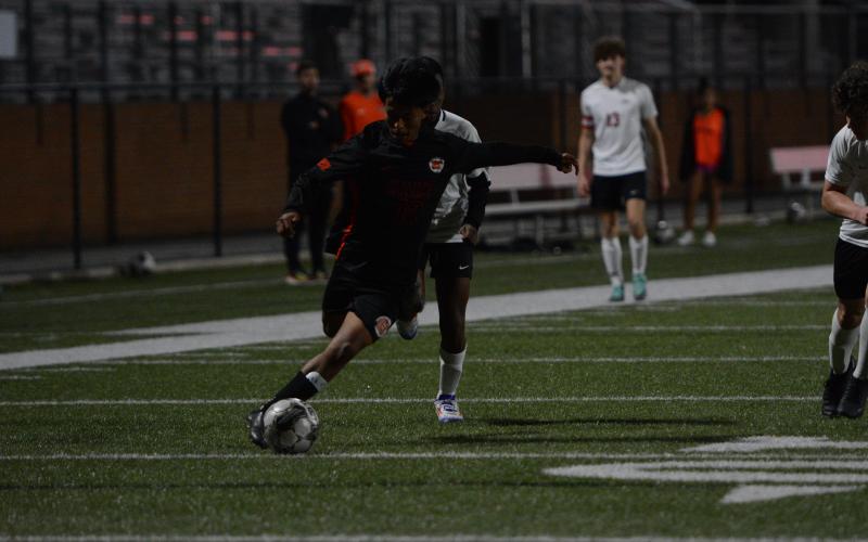 Jose Mendez sneaks in a goal in the historic 3-0 win over the Indians of Stephens County on March 21. (Photo/Benjamin London)