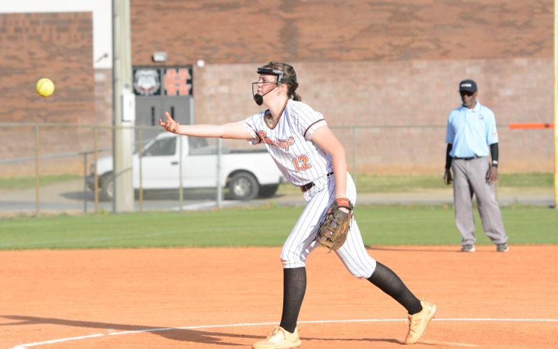 Junior infielder Kinsley Duncan delivers the pitch in the game one loss to Elbert, 17-6. But then went 2-3 at the plate in game two to help elevate the Lady Dogs to a 13-8 win. (Photo/Benjamin London)