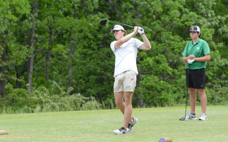 Senior Lucas Fritz teeing off on Hole 14 as he shot an 83 to help the Dogs tie with Drew Carter and help win the playoff hole to capture the Area Championship. (Photo/Benjamin London)
