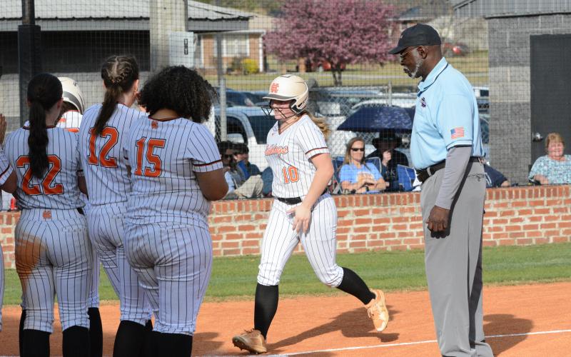 Peyton McCollum (10) trots around the bases after a two-run home run in the 17-6 loss to the Lady Devils of Elbert County in game one, and then Hart proceed to win game two, 13-8. (Photo/Benjamin London)