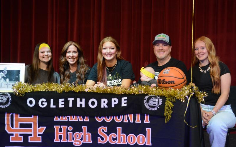 Pictured is Channing Segars (third from left) alongside her family after signing with the Stormy Petrels of Oglethorpe University on March 25 from the Lonnie Burns Fine Arts Center on the campus of Hart County High School. (Photo/Benjamin London)