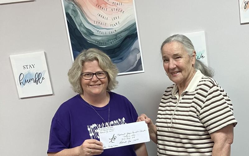 Pictured during a check presentation from St. Andrew’s Episcopal Church to the Northeast Georgia Council on Domestic Violence are (L-R) Christy Osborne of the NEGACDV and Nancy Dunn from St. Andrew’s. (Photo submitted by Rhea Dignam)