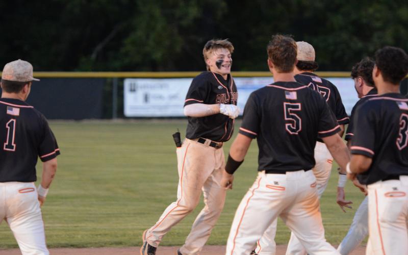 Freshman infielder Slate Osborne (left) walks it off in the 4-3 win in game two on April 25. (Photo/Benjamin London)
