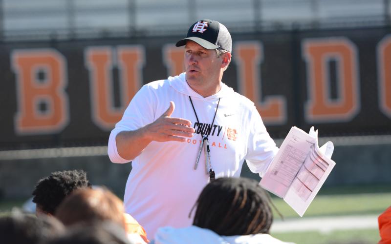 Head football coach Cory Dickerson speaks with the team after their third practice of the spring on May 6. (Photo/Benjamin London)