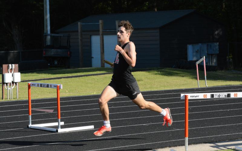 Senior Nate Harris qualifies for state after placing second in the 4x800-meter relay and third in the 800-meter run and the 1600-meter run at Sectionals on May 3. (Photo/Benjamin London)