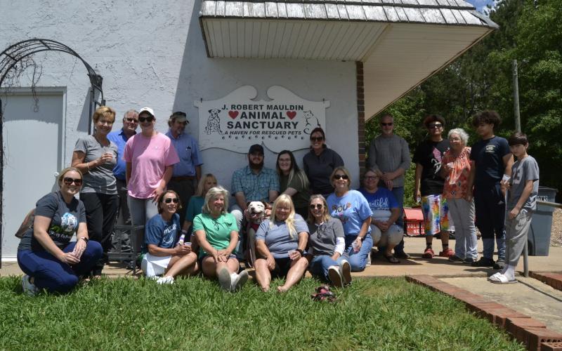 friends and volunteers of the Hart County Humane Society celebrate during the “Adoption Paw-ty” for beloved dog, TeeChee, May 4. (Photo/Adriana Cascio)
