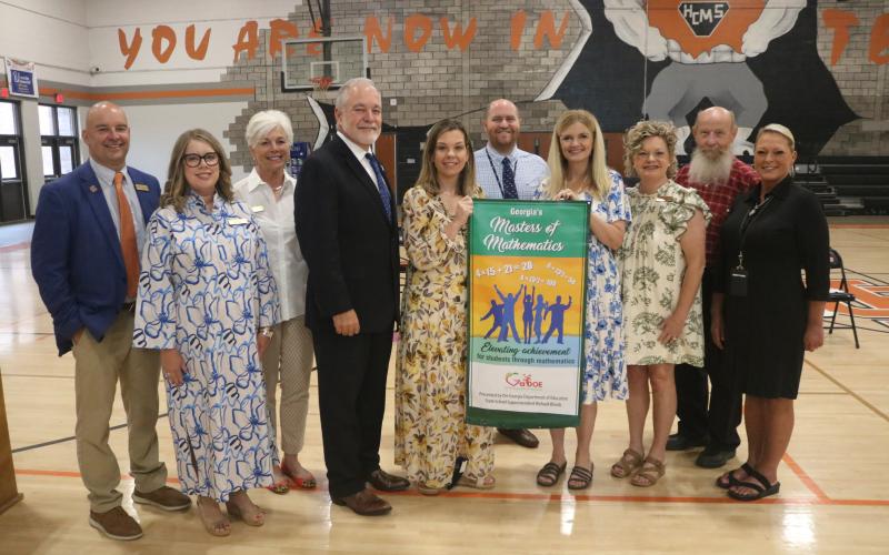 Pictured are (L-R) Associate Superintendent Brooks Mewborn, Hart County Board of Education members Kim Pierce and Henley Cleary, State Superintendent Richard Woods, HCMS Principal Dr. Jackie Brock, HCMS Assistant Principals Trae Jones and Tonya Bridges, Superintendent Jennifer Carter, Hart County Board of Education member Dennis Dowell, and Assistant Superintendent Lydia Bennett. (Photo/Grayson Williams)