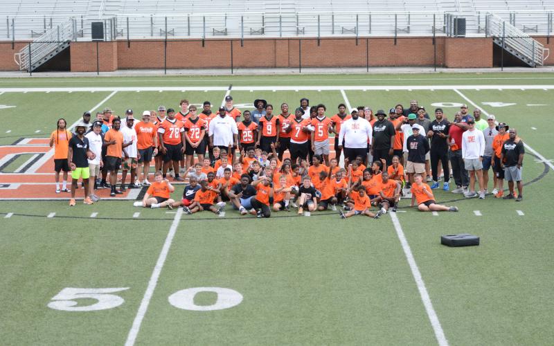Former and current Bulldogs help instill the passion and love for football to the future Bulldogs at the inaugural Harper Island Youth Football Camp in Herndon Stadium June 14. (Photo/Benjamin London)