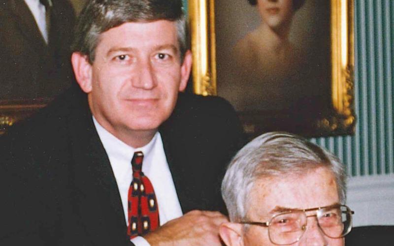 This photo—taken in December 1997—was my dad’s last Christmas with us. Until our mother died in 2014, the Leon Loard portraits, in the background, of sisters Sandy and Sheila (pictured) and me always hung side by side. Today the portraits are in each of our homes. (Photo submitted by NeSmith)