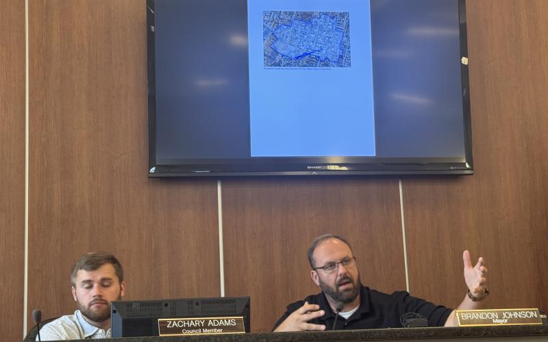 Mayor Brandon Johnson (right) sitting with council member Zachary Adams (left), speaking out to the public about a new rezoning ordinance proposed at Monday's city council meeting. The ordinances are available to the public on the city council website and are not finalized. (Photo/Adriana Cascio)