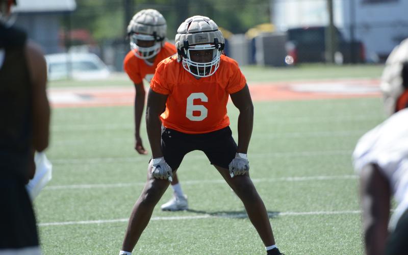 Rising senior defensive lineman Isaac McNeil gets in his stance before the snap. (Photo/Benjamin London)