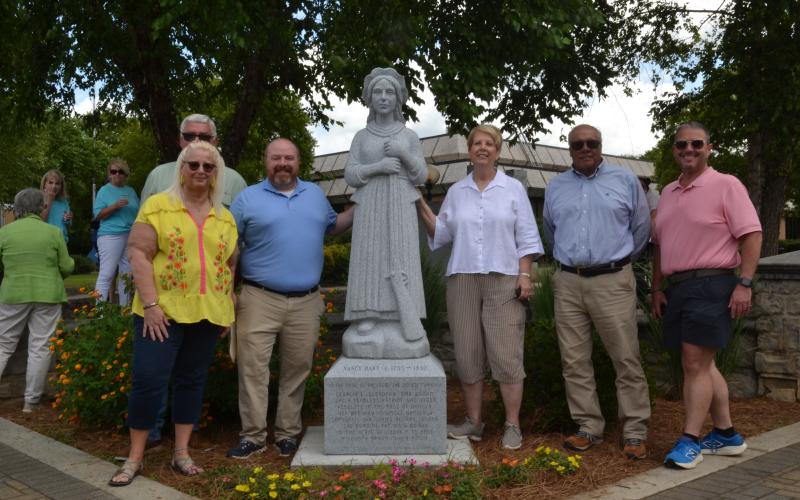 The Downtown Development Authority (DDA) poses with Downtown Hartwell’s new Nancy Hart statue after its grand unveiling ceremony on June 18. Economic and Community Development Director Jason Ford and the DDA spent about 5 years planning and designing this monument. (Photo/Adriana Cascio)