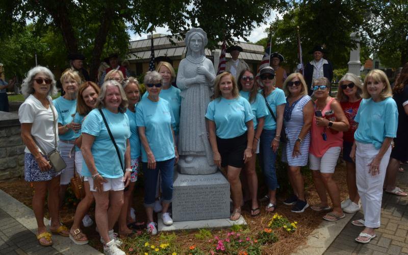 Hartwell Main Street volunteers pose in front of Downtown Hartwell’s new Nancy Hart statue after its grand unveiling ceremony on June 18. (Photo/Adriana Cascio)