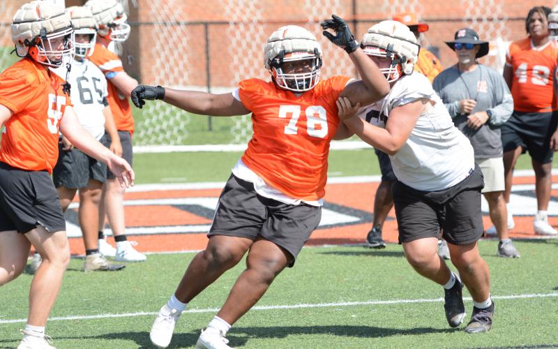 Rising senior defensive lineman Nicholas Carter works on rushing the quarterback. (Photo/Benjamin London)