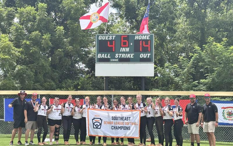 The Hart County Senior League Softball team poses in front of the scoreboard showcasing their dominating 14-4 win over Florida in the Southeast Regional Championship Monday in Clarkesville, Tennessee. As the Southeast Regional Champions, the team will represent Hart County in the Senior League Softball World Series for the first time in Hart County history July 28 through Aug. 3 in Lower Sussex, Delaware. (Photo courtesy of Hart County Little League)