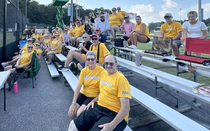A team of fans, donned in yellow Southeast shirts, cheered on Hart County’s Senior League Softball team during games in Lower Sussex, Delaware earlier this week.