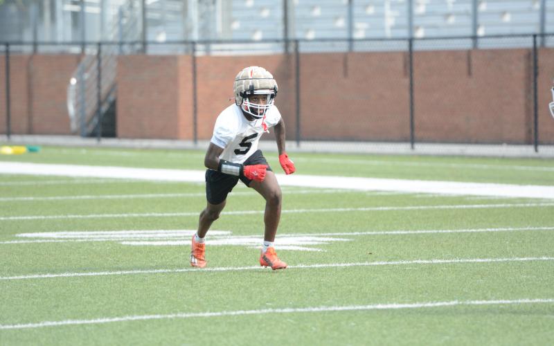 Rising senior receiver CJ Cowins runs a route during a summer practice. (Photo/Benjamin London)
