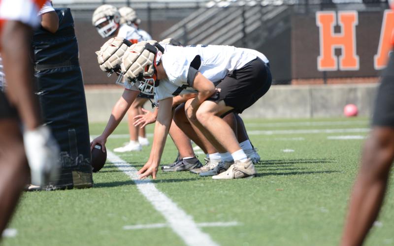 Rising senior left tackle Chris Collins lines up before the snap during a summer practice. (Photo/Benjamin London)