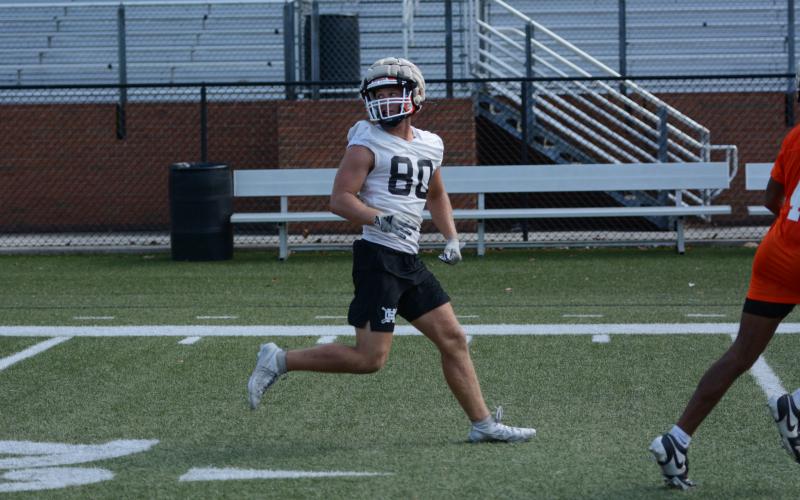 Rising senior tight end Coleman Moore runs a route during a summer practice in Herndon Stadium. (Photo/Benjamin London)