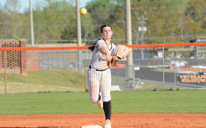 Emory McCollum throws over to first during a slow-pitch game in 2025. (Photo/Benjamin London)
