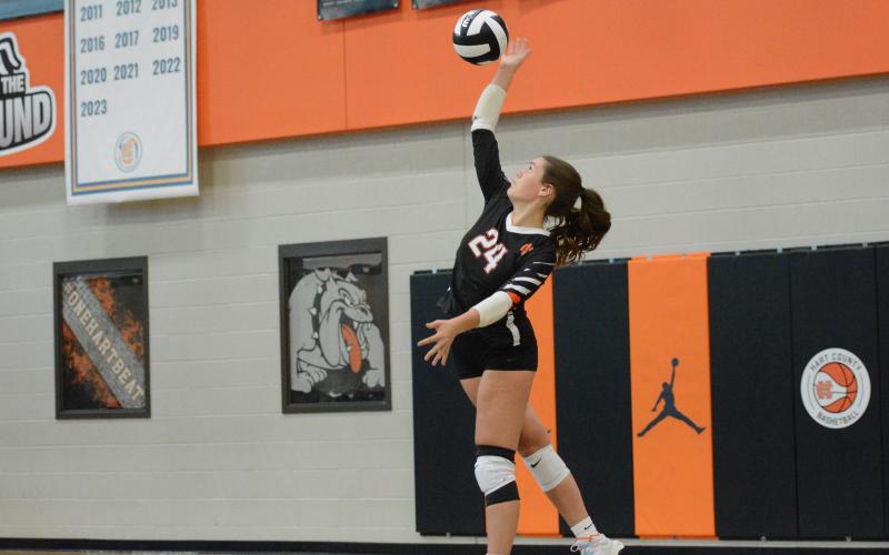 Sophomore right side hitter Coley Phillips serves the ball into play during the 3-0 win over Athens Christian. (Photo by Benjamin London)