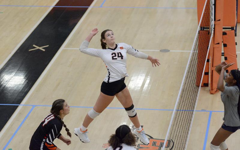 Sophomore Coley Phillips goes for the kill during a home match earlier in the season. (Photo by Benjamin London)