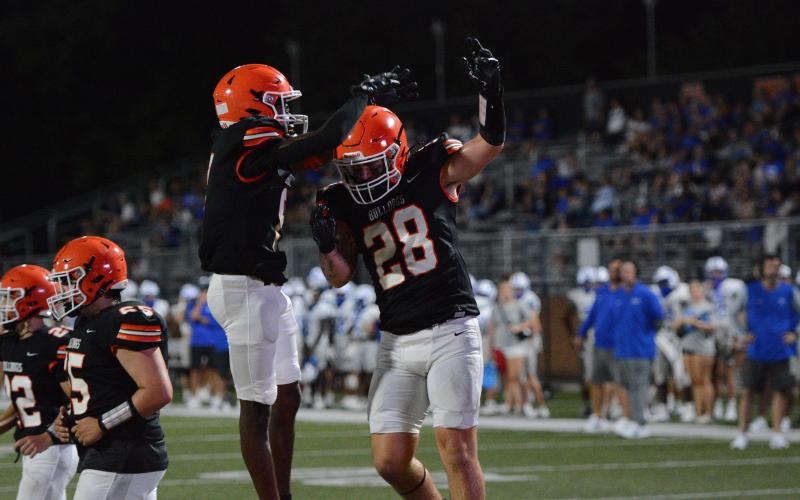 Senior tight end Boston Graham (right) celebrates with senior wide receiver CJ Cowins (left) after the touchdown in the 28-6 win over the Warriors of Oconee County in a scrimmage Aug. 8.  (Photo by London)