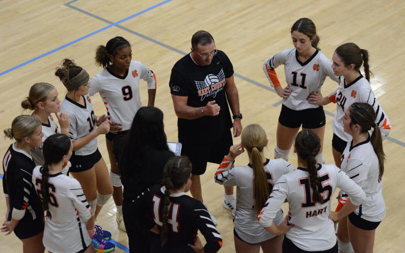 Assistant coach Mike Atkins speaks to the team during a timeout in the win over Elbert County Aug. 12.  (Photo by London)