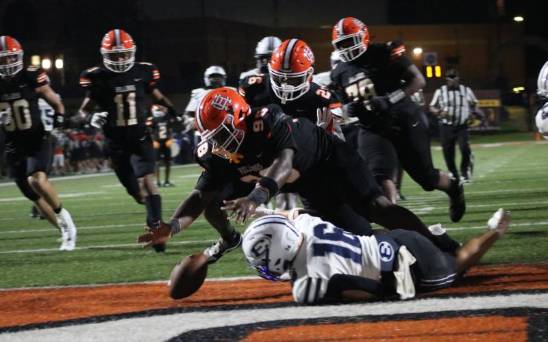 Sophomore defensive lineman Kayvion Dooley looks to pounce on the loose ball as he later scooped and scored the touchdown in the 51-20 win over Elbert County. (Photo by Grayson Williams)