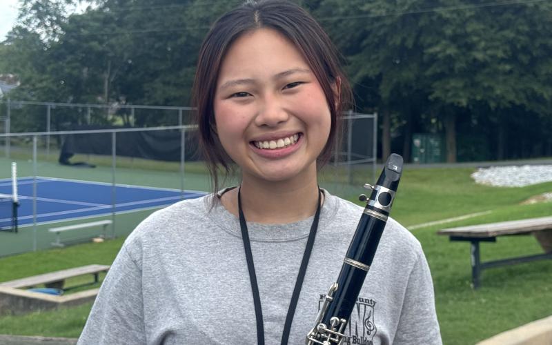 Head Librarian Miley Huynh smiles brightly with her clarinet in hand after being named officer of the week for this week’s High Notes series. As head librarian, Huynh is responsible for ensuring all band members are equipped with their sheet music, requiring a high level of organization and patience. (Photo by Adriana Cascio)