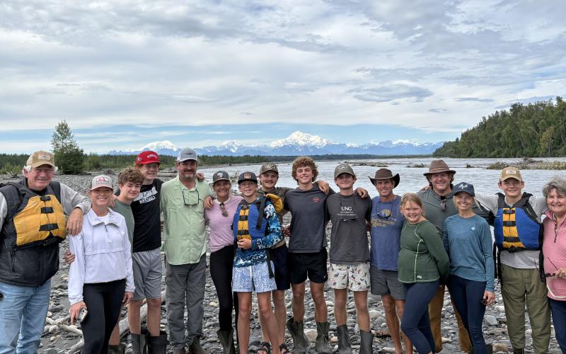 One of the highlights of the 10-day Alaska adventure was rafting down the Chulitna River in Talkeetna and getting a rare view of North America’s tallest mountain, unobstructed by clouds. With Denali, aka Mount McKinley, in the background are, from left, Dink NeSmith, Heather NeSmith, William NeSmith, Fenn NeSmith, Alan NeSmith, Emily N. Wilson, Smith Wilson, Wyatt Wilson, Henry Wilson, Hayes Wilson, Tom Wilson, Stella NeSmith, Eric NeSmith, Connell NeSmith, Bayard NeSmith and Pam NeSmith. (SubmittedNeSmith)