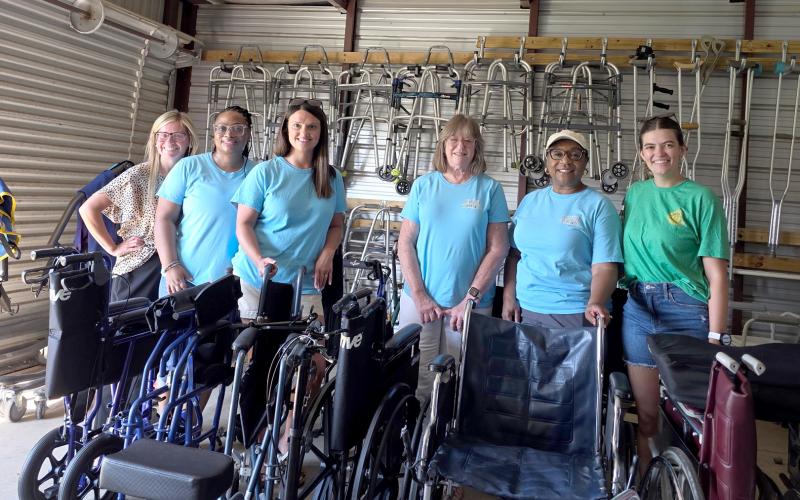 Pilot Club of Hartwell members (L-R) Laura Reed, Takia Wakefield, Tammy Beard, Joylynn Wilson, Chiquita Clark and Katelyn Wray pose inside a storage unit dedicated to the Friendship House program. The storage unit is fully stocked with walkers, wheelchairs, knee scooters and other medical supplies that are to be given to community members free of charge. (Photo submitted by Wray)