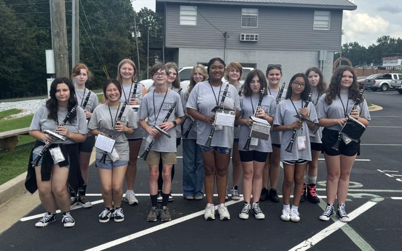 Clarinetists pose together after being named section of the week for this week’s High Notes series. Curry, section leader, said she is proud of her team for their hard work and excellent performance during the first football game of the season on Aug. 15. (Photo by Adriana Cascio)