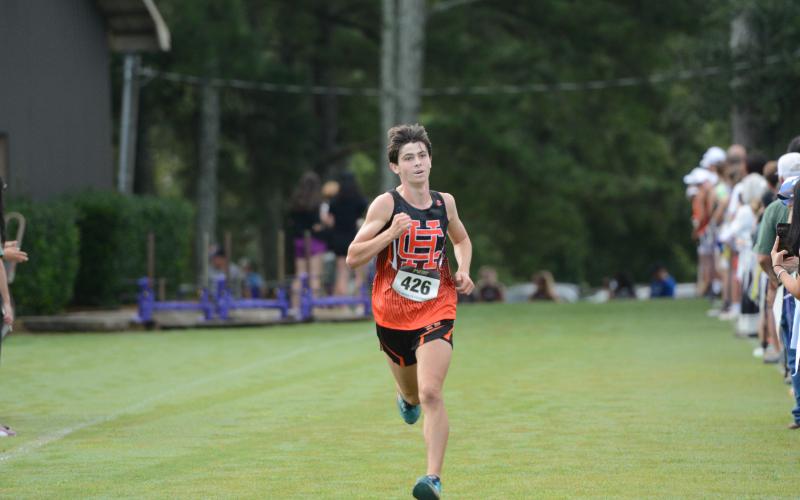 Junior runner Sevyn Singleton placed eighth overall to help the team finish third at Athens Christian Aug. 16. (Photo by Benjamin London)